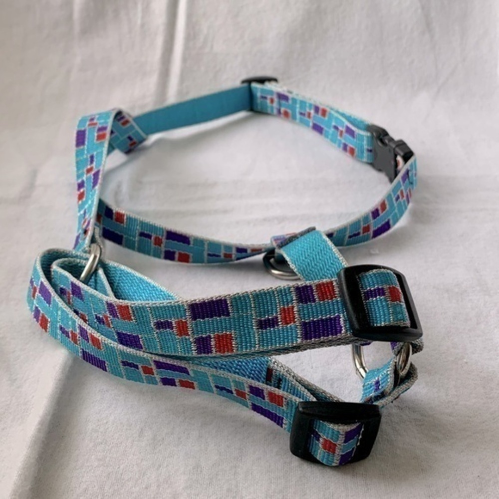 Never used. Beautiful and bright colors, Dog Harness with quick snap release.
